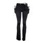 Black LVAD leggings, side view from the right with a battery in the hip pocket